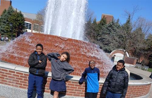  4 students standing in front of the Detroit Water Fall